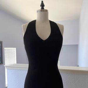 Black sweater knit dress with racer back styling by Moda International, Size S